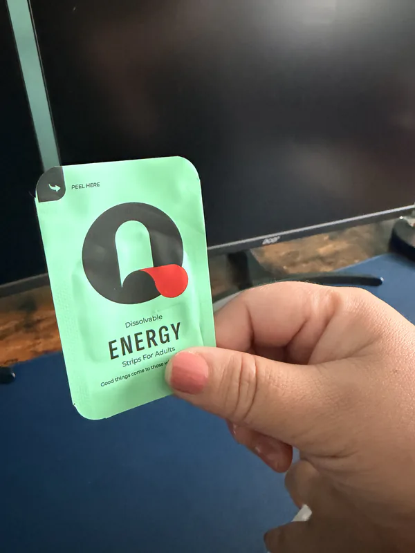 Tina holding an Energy Que-Strips packet
